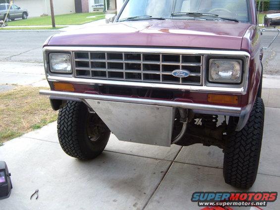 Maroon 1983 Ford Bronco II front end with custom metal skid plate and bumper