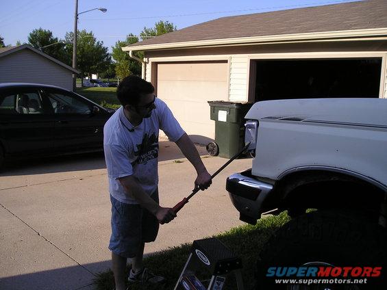 remove corner lights(or the bucket) for easy access to the screws that hold the trim piece on.