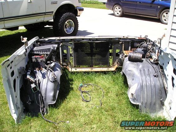 remove everything from the fenders except the jack holder, remove the condenser, leave the tranny cooler-it's bigger on mine-save the wiring harness you'll need the pigtails for the lights.