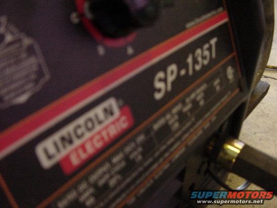 Lincoln Electric SP-135T welder with a dial and some text labels
