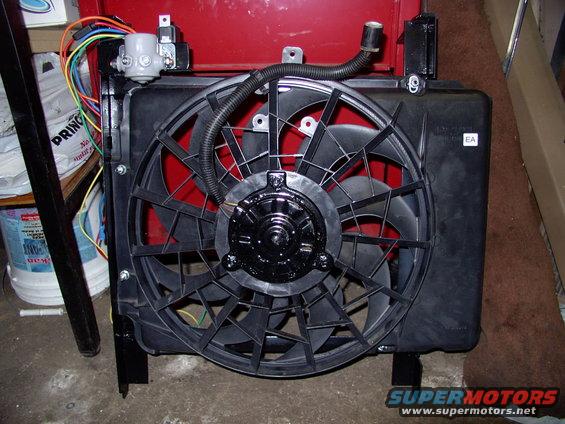 img_0072.jpg Here you can see the painted, completed frame. The fan is mounted on studs (4) as are the Cole-Hersee 85 amp contiuous duty solenoid and the Derale temp controller.