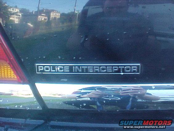 Police Interceptor badge on dark vehicle rear