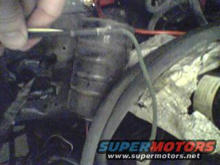 Close-up of alternator wiring with SuperMotors logo