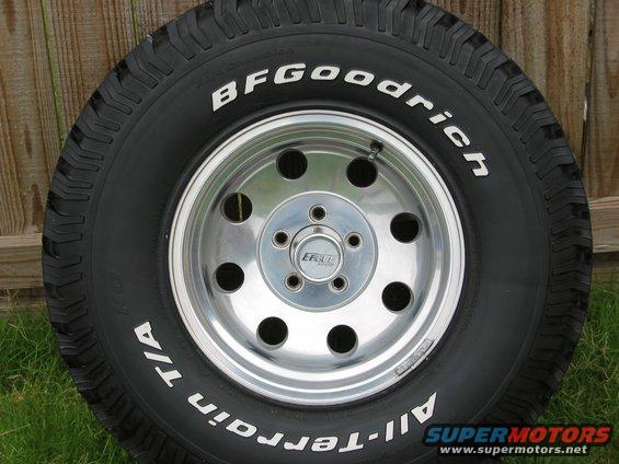 BFGoodrich All-Terrain T/A tire mounted on a chrome 5-lug wheel with an Eagle center cap