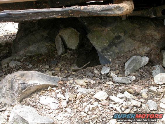 dscn2236.jpg Uprooted this rock with my radius arm drop bracket.  Also, more evidence that a nerf bar does not a slider make.