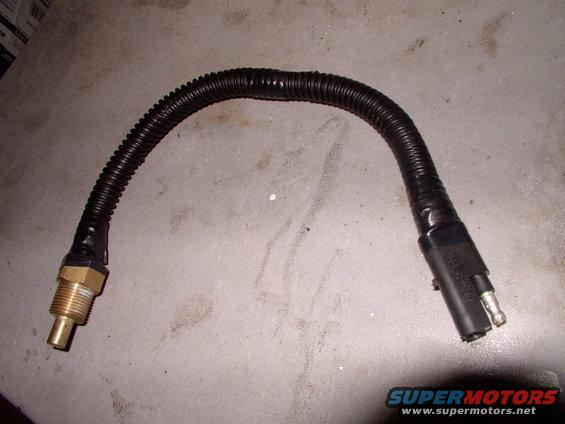img_0141.jpg I cut and lengthened the supplied wet sensor's wires to reach the T-stat housing, which has a threaded provision. The taped on wiring convolute will help it cope with Canadian Winters and salt. The foolproof disconnect was courtesy of a Mopar.