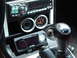 1986 Mazda RX-7 - The dashboard features a digital display and two prominent circular gauges.