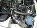 1986 Mazda RX-7 - Close-up of an engine bay an aftermarket air intake system with a chrome air filter.