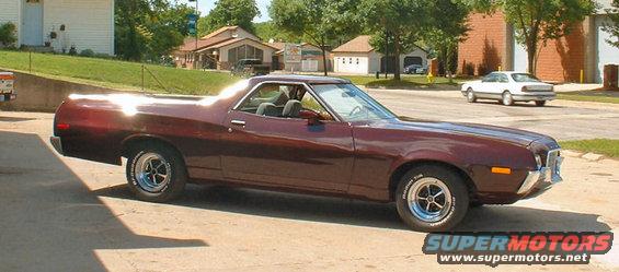 1972 Ford Ranchero parked on a paved surface with a white car in the background