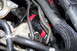 1997 Ford Probe - Close-up view of various hoses and wiring harnesses within an engine compartment.