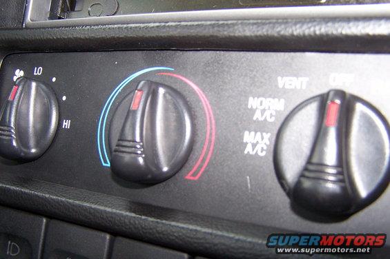 Interior climate control knobs with labels for LO, HI, NORM A/C, MAX A/C, VENT, and OFF