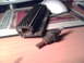 1997 Ford Probe - A spark plug and a heat sink are displayed on a desk, with a computer mouse and mousepad in the background.