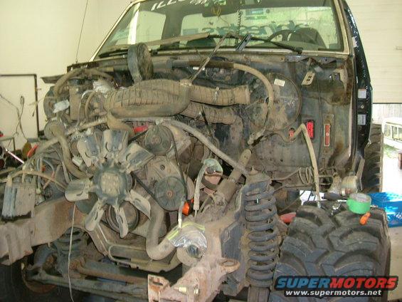 1995 Ford F-150 engine bay with front end removed, showing engine and suspension components