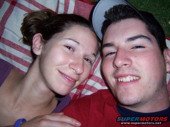 Couple lying on a red and white checkered blanket