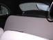 1964 Volkswagen Beetle - The interior of a 1964 Volkswagen Beetle shows grey fabric seats and a black headliner.