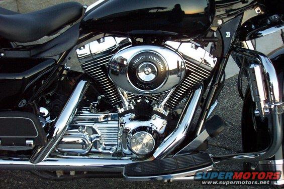 Black Harley-Davidson Police motorcycle engine with chrome details. Text reads 'Harley-Davidson Police'