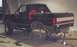 1988 Ford Bronco - Springs off and rear end resting on the jack.