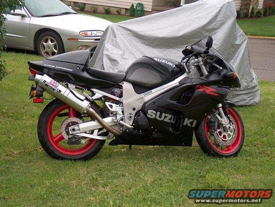 Side view of a black 2002 Suzuki TL1000R sportbike with red wheels