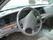 1996 Ford Crown Victoria - The interior of a 1995 Ford Crown Victoria, with a focus on the dashboard and steering wheel.