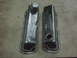 1979 Ford Bronco - Two chrome Edelbrock valve covers are shown, one with a red gasket, on a textured surface.