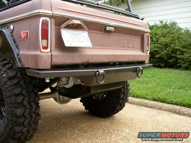 Rear view of a 1978 Ford Bronco with aftermarket bumper and large off-road tire