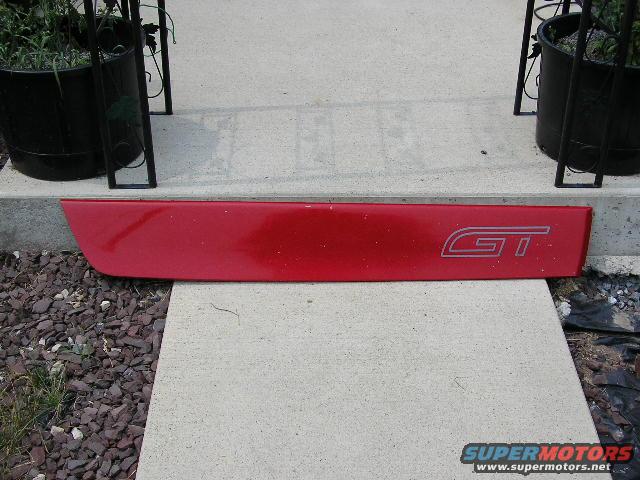 red trim piece with GT logo