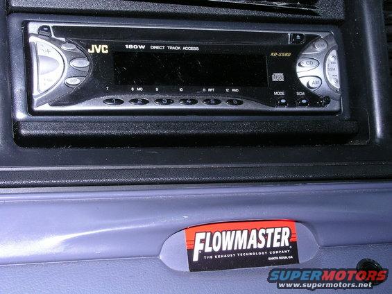 Car interior showing a JVC KD-S580 stereo and a Flowmaster exhaust sticker