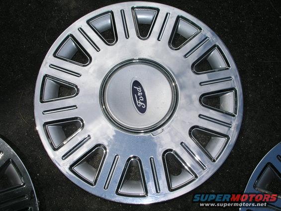 Chrome Ford wheel cover with blue oval logo