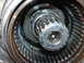 1995 Ford Bronco - A detailed view of a vehicle's internal gear mechanism, showing wear and tear on the components.