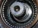 1995 Ford Bronco - A detailed view of a vehicle's hub assembly, showing the internal splines and central threaded opening.