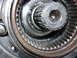 1995 Ford Bronco - A close-up view of a vehicle's hub assembly, showing internal gears and wear.