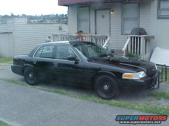 Black 1999 Ford Crown Victoria police car, 3q front view