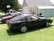 1984 Nissan 300ZX - Two Nissan 300ZX cars are parked on a lawn in front of a garage and shed.