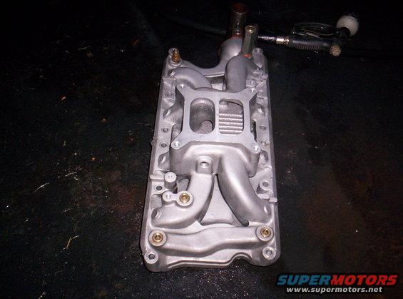 Aluminum intake manifold with four bolt holes on top