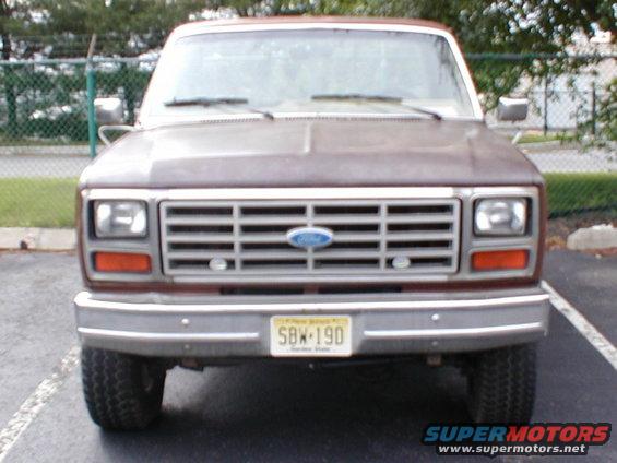 Front view of a 1979 Ford Bronco with a brown body and chrome grille