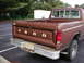 1979 Ford Bronco - Rear view of a brown Ford pickup truck, likely from the late 1970s or early 1980s, with a chrome bumper and visible license plate.