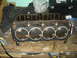 1986 Ford Mustang - Engine block and gasket assembly, likely for a V8 engine, on a workbench.