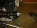 1986 Ford Mustang - A camshaft is shown secured in a vise, ready for inspection or modification.