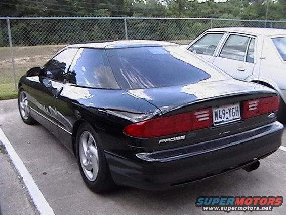 Black 1993 Ford Probe parked next to a white car