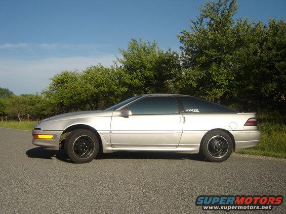 Silver 1990 Ford Probe coupe, side view