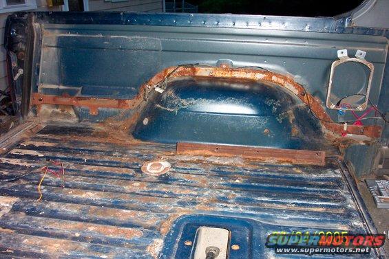 bronco2-6405.jpg Rear seat and carpet removed. Backseat bracket is angle iron. Original seats gone, seats are from conversion van.