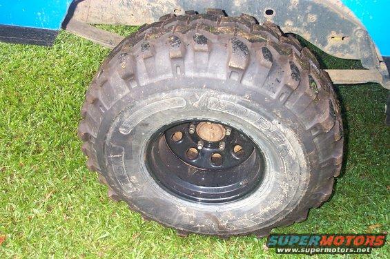 Off-road tire on blue vehicle