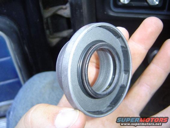 Metal part with rubber seal held in hand