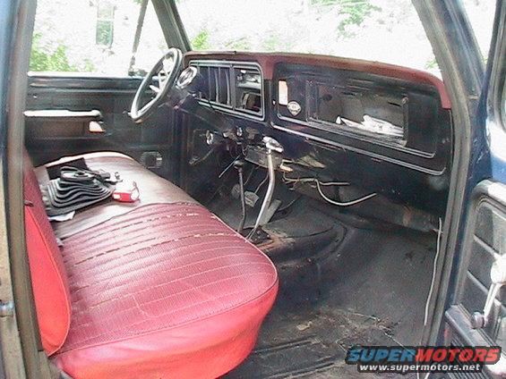Red bench seat and dashboard of a 1977 Ford F-250