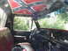 1977 Ford F-250 - Interior view of a 1977 Ford F-250, a custom Confederate flag headliner.