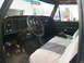 1977 Ford F-250 - The interior of a truck is shown, the dashboard, steering wheel, and seats. A watermark is visible at the bottom right.