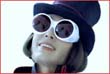 guy wearing a top hat and big white goggles