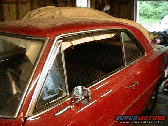 Red 1966 Chevrolet Nova coupe, side view, showing interior and chrome trim
