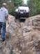 2000 Jeep Cherokee - A Jeep Grand Cherokee tackles a challenging rocky terrain on an off-road trail.