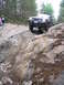 2000 Jeep Cherokee - A Jeep Grand Cherokee tackles a challenging off-road course with steep, rocky inclines.